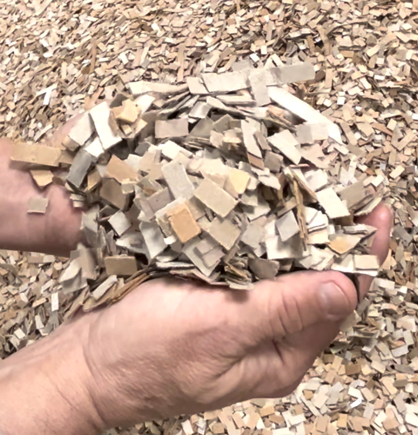 cardboard bedding in a person's hand