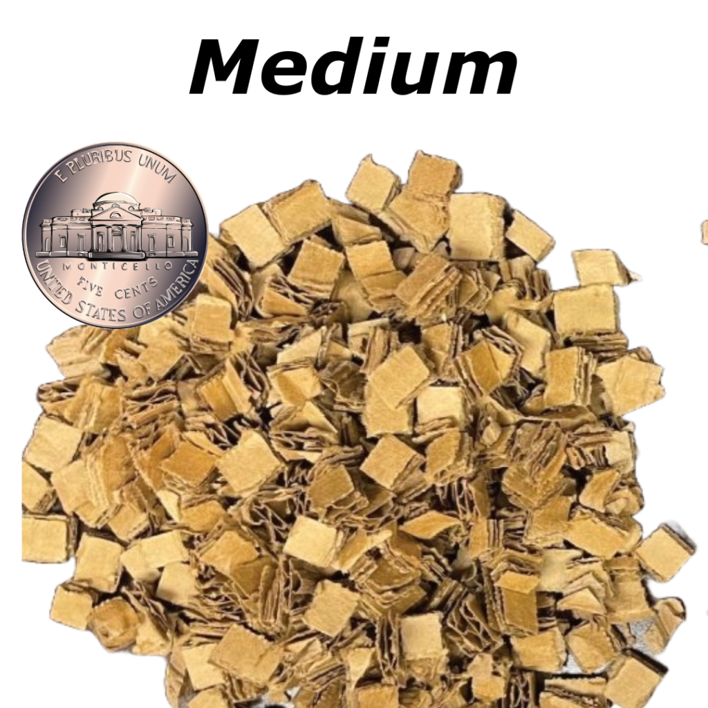 A pile of small wooden blocks sitting next to a penny.
